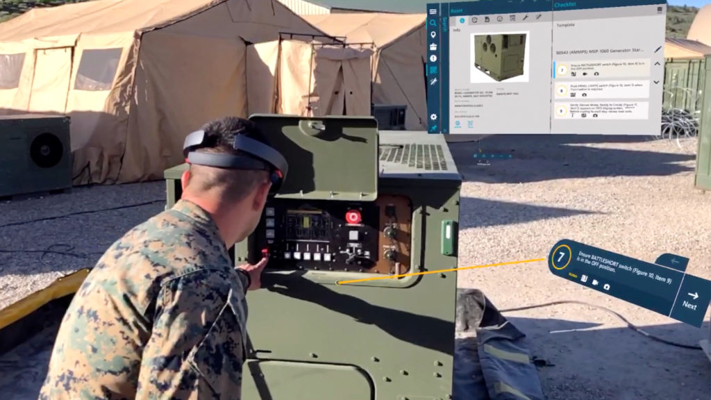 U.S. Marine inspecting generator with digital work instructions