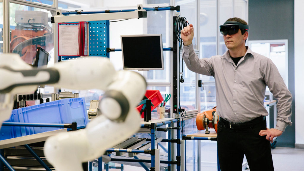 man in a lab using an augmented reality headset