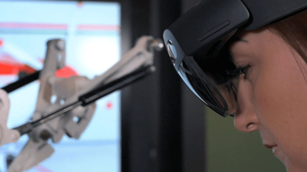 woman wearing ar headset while working
