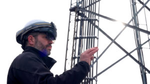 utility worker standing with augmented reality helmet on