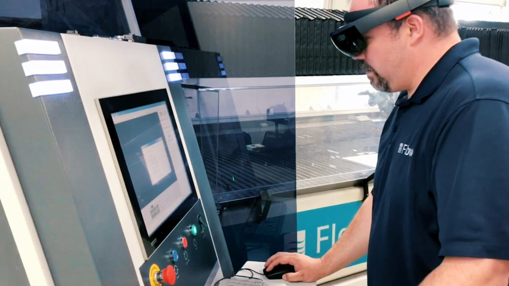 flow waterjet employee working using augmented reality headset