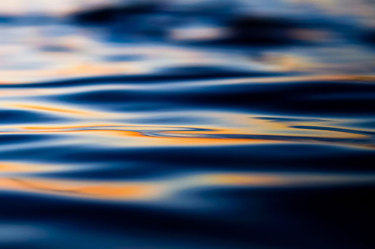 rippling water with sunset reflection