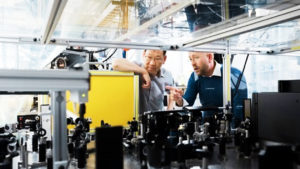 men looking at machinery