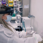 woman using augmented reality goggles in a laboratory