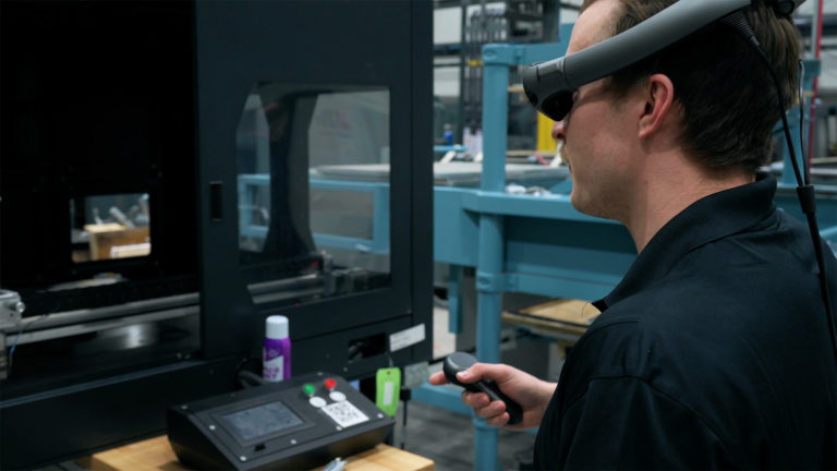 man wearing ar headset to complete a task