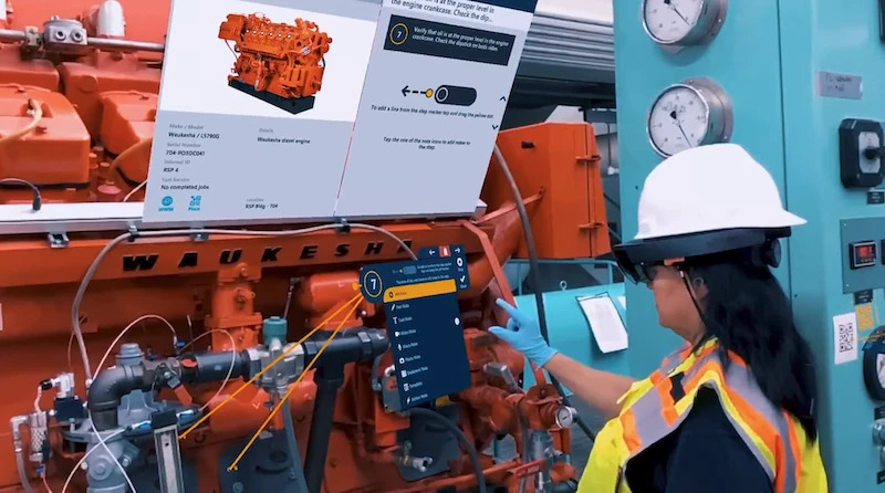 woman in hard hat working on a machine using ar work instructions