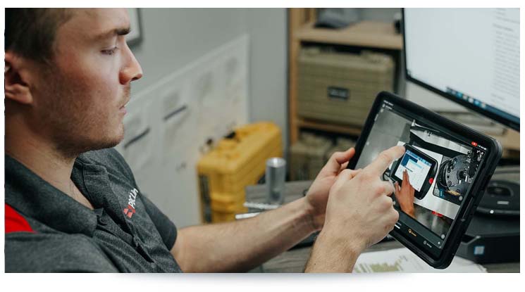 man performing task with ar work instructions on a tablet