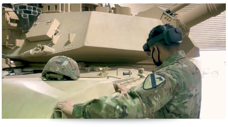 soldier inspecting a tank with augmented reality goggles