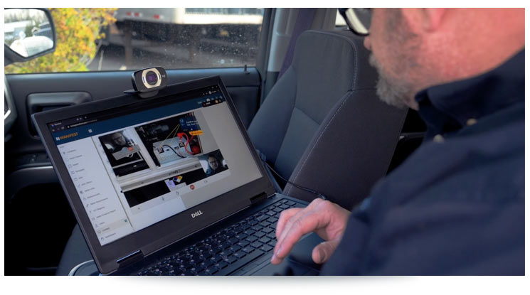 man on a laptop sitting in his car